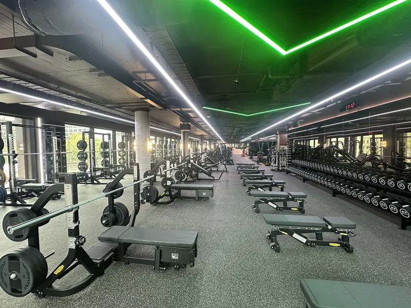 Training floor and mirrored wall under green LED lighting